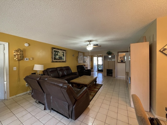 6302 Tall Cypress Cir, Greenacres, FL 33463 - living area with a ceiling fan, light tile patterned floors, a textured ceiling, and baseboards