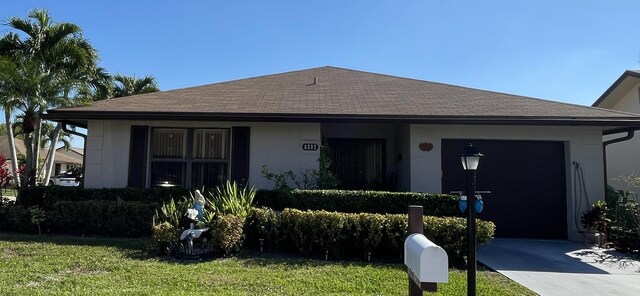 6302 Tall Cypress Cir, Greenacres, FL 33463 - view of front facade featuring concrete driveway, roof with shingles, an attached garage, and a front yard