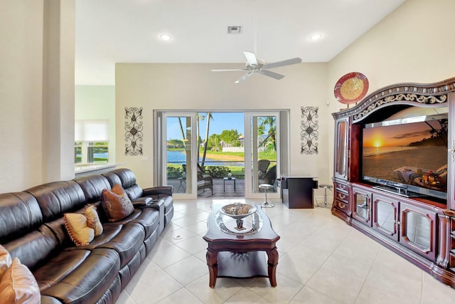 living area featuring light tile patterned floors, visible vents, and recessed lighting