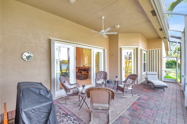 9429 Lantern Bay Cir, West Palm Beach, FL 33411 - view of patio with a ceiling fan and glass enclosure