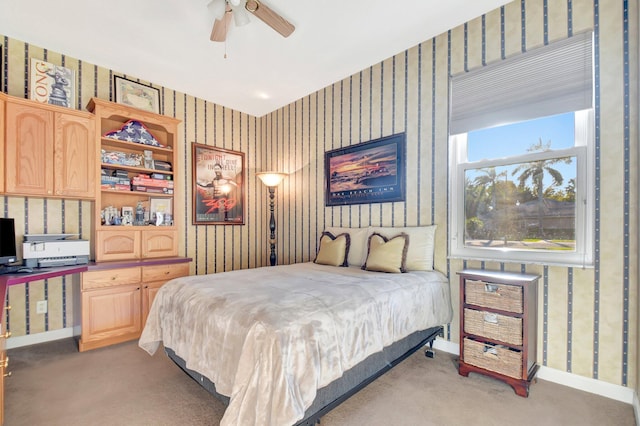 bedroom featuring baseboards, light colored carpet, and wallpapered walls