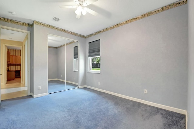 9429 Lantern Bay Cir, West Palm Beach, FL 33411 - unfurnished bedroom featuring carpet, baseboards, a closet, and a ceiling fan