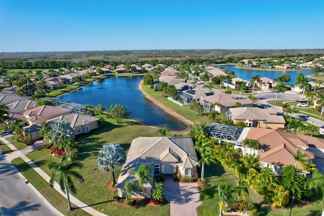 bird's eye view with a residential view and a water view