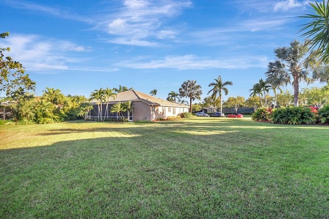 view of yard featuring a lanai