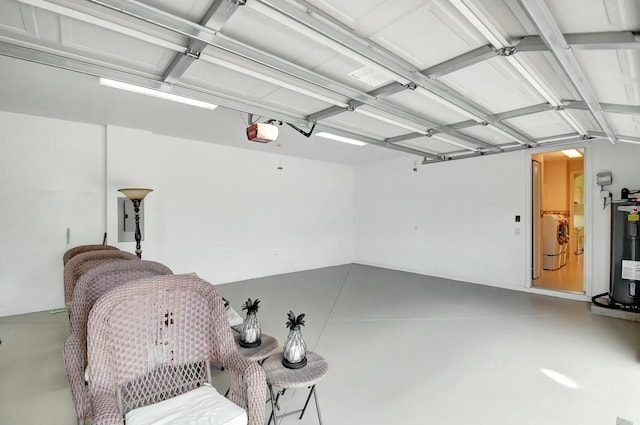 9429 Lantern Bay Cir, West Palm Beach, FL 33411 - garage featuring water heater, washer / dryer, and a garage door opener