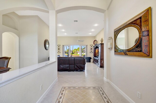 dining area with a chandelier, a tray ceiling, and baseboards