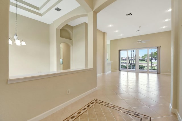 9429 Lantern Bay Cir, West Palm Beach, FL 33411 - tiled empty room with baseboards, a chandelier, a high ceiling, recessed lighting, and a ceiling fan