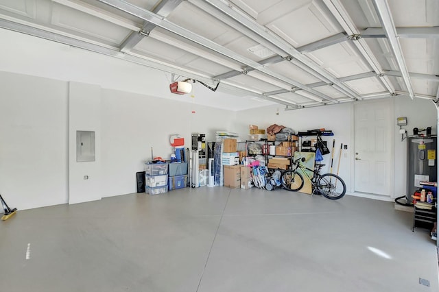 garage with a garage door opener, electric panel, and electric water heater