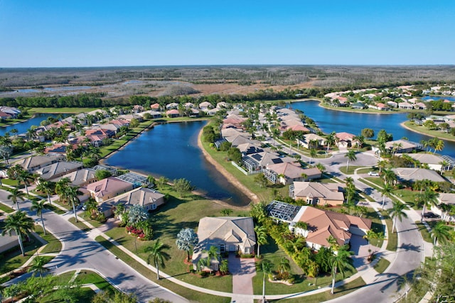 bird's eye view with a water view and a residential view