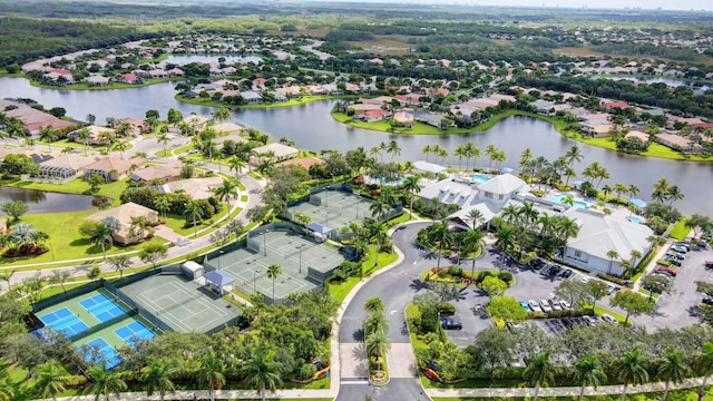 birds eye view of property featuring a water view and a residential view