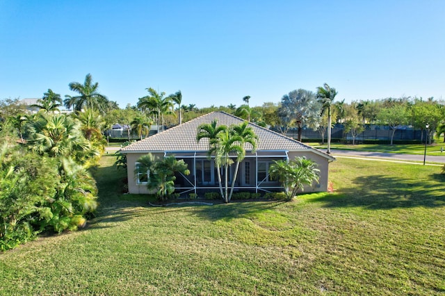 9429 Lantern Bay Cir, West Palm Beach, FL 33411 - view of grassy yard featuring a lanai