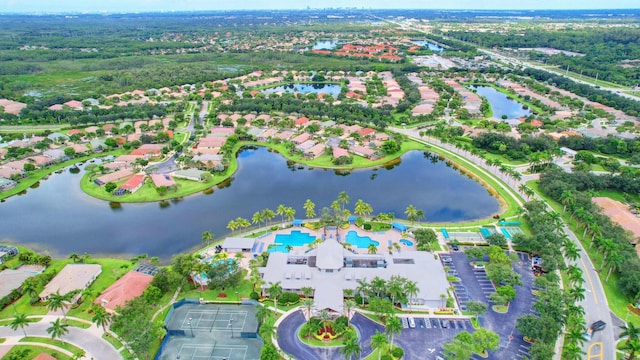 drone / aerial view featuring a residential view and a water view