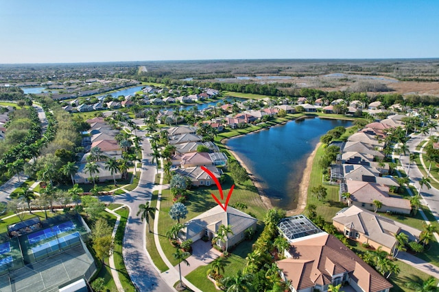 9429 Lantern Bay Cir, West Palm Beach, FL 33411 - aerial view of property and surrounding area featuring nearby suburban area and a large body of water