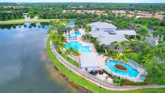 9429 Lantern Bay Cir, West Palm Beach, FL 33411 - aerial view of a pool, a large body of water, and a tree filled landscape