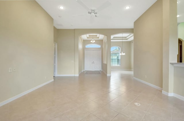 9429 Lantern Bay Cir, West Palm Beach, FL 33411 - spare room with arched walkways, a ceiling fan, light tile patterned floors, baseboards, and recessed lighting
