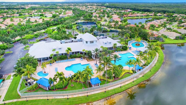 bird's eye view featuring a water view and a residential view