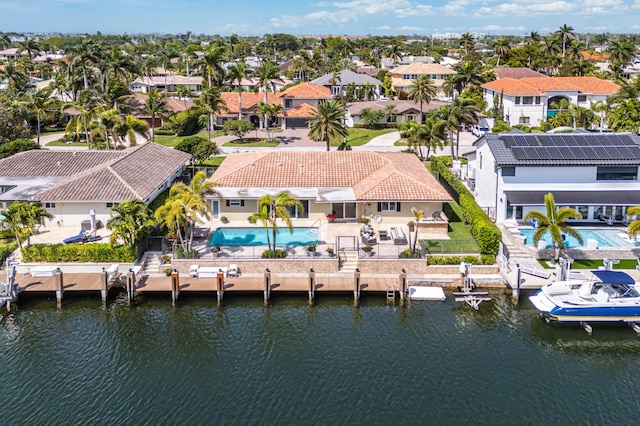 bird's eye view featuring a water view and a residential view