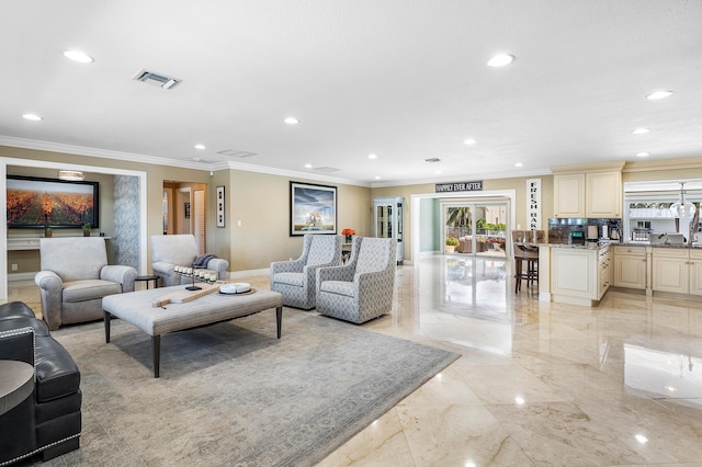 living area with marble finish floor, visible vents, crown molding, and recessed lighting