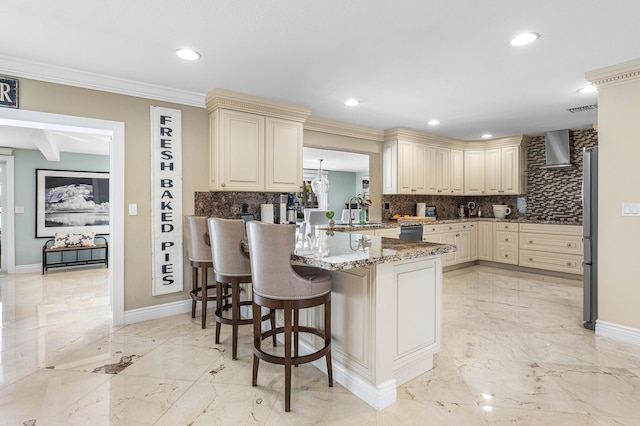 kitchen with marble finish floor, visible vents, and cream cabinetry