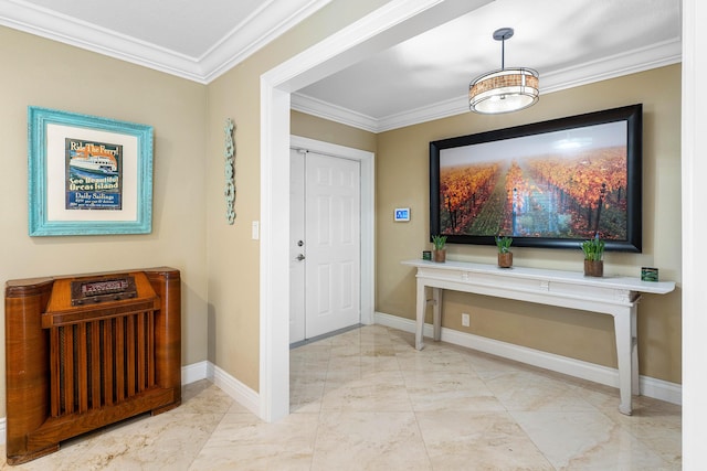 foyer with marble finish floor, crown molding, and baseboards