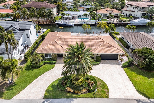 birds eye view of property featuring a water view and a residential view