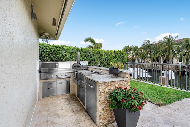 view of patio / terrace featuring a grill, fence, and area for grilling