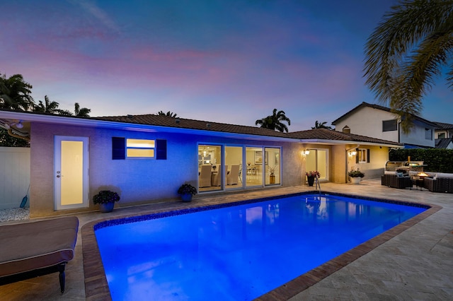 outdoor pool featuring a patio area