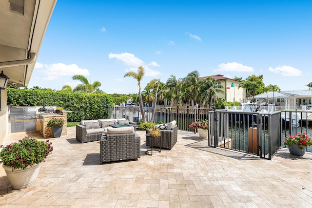 view of patio / terrace with outdoor lounge area, fence, grilling area, and area for grilling