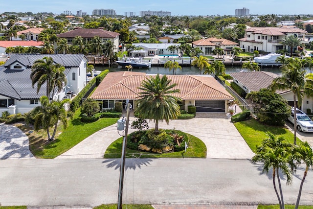 birds eye view of property featuring a residential view and a water view