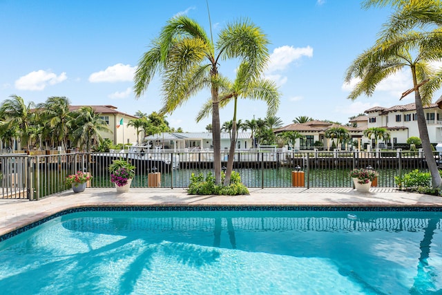 view of pool with fence, a residential view, and a fenced in pool