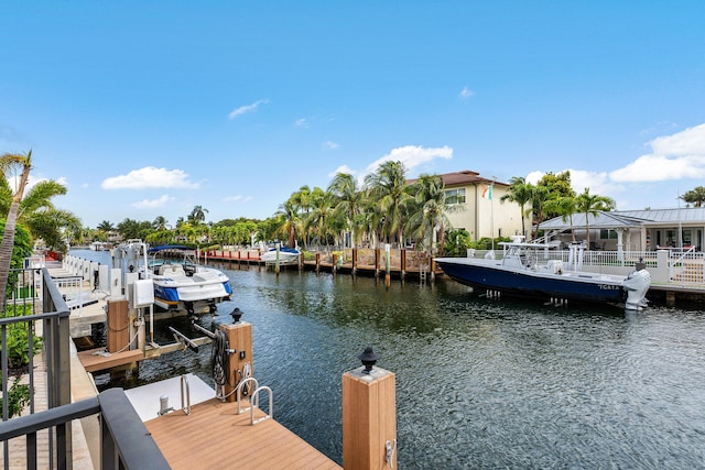 view of dock featuring a water view and boat lift