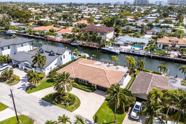 bird's eye view featuring a water view and a residential view