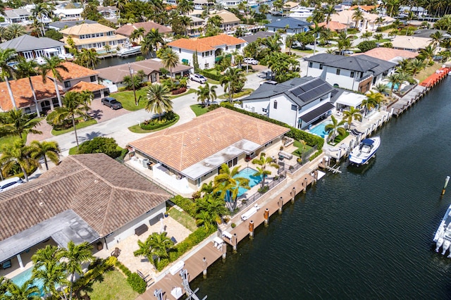 birds eye view of property with a water view and a residential view