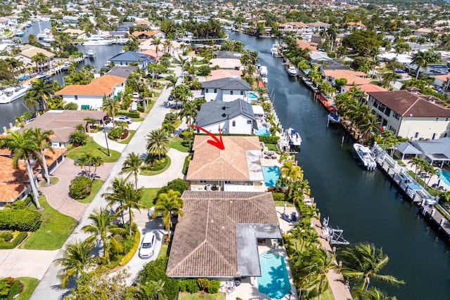 birds eye view of property featuring a water view and a residential view