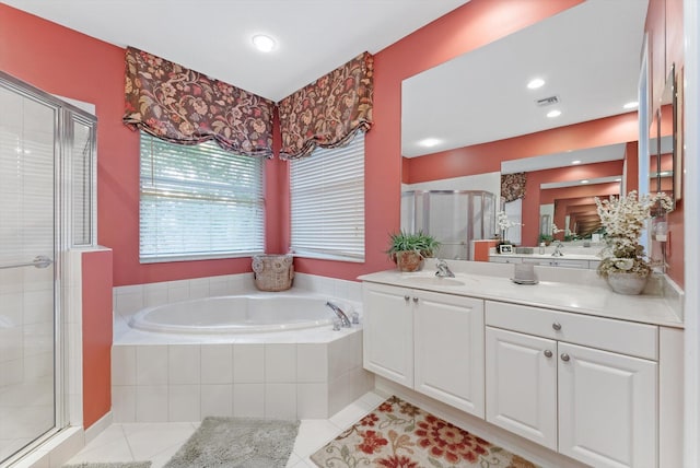 full bathroom featuring tile patterned flooring, visible vents, a shower stall, a bath, and vanity