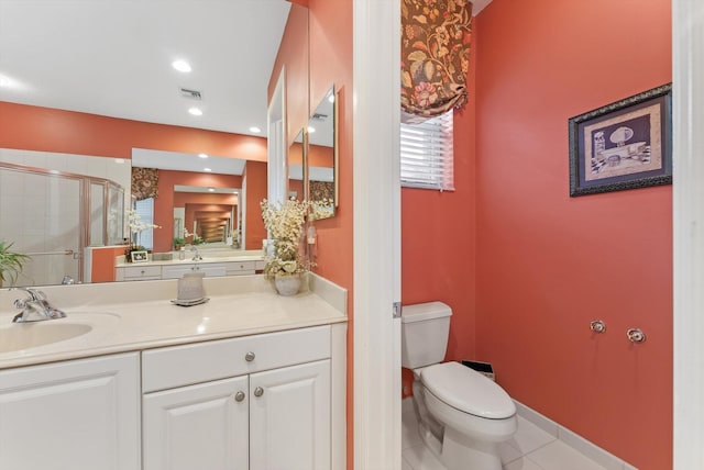 full bathroom with vanity, visible vents, a shower stall, tile patterned floors, and toilet