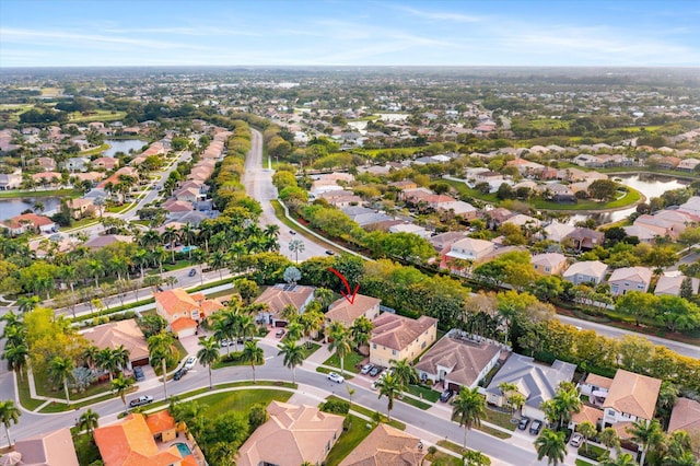 bird's eye view with a residential view and a water view