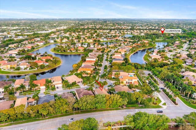 birds eye view of property featuring a residential view and a water view