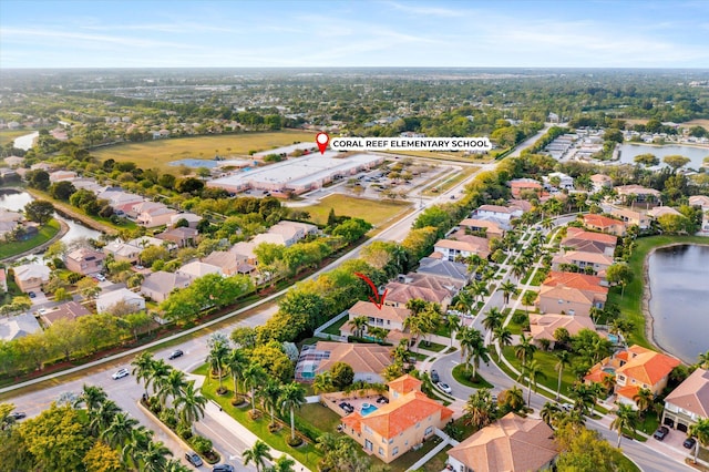 aerial view featuring a residential view and a water view