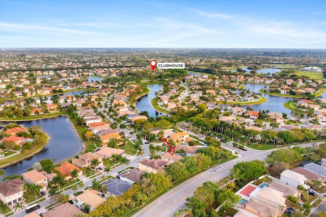 bird's eye view with a residential view and a water view