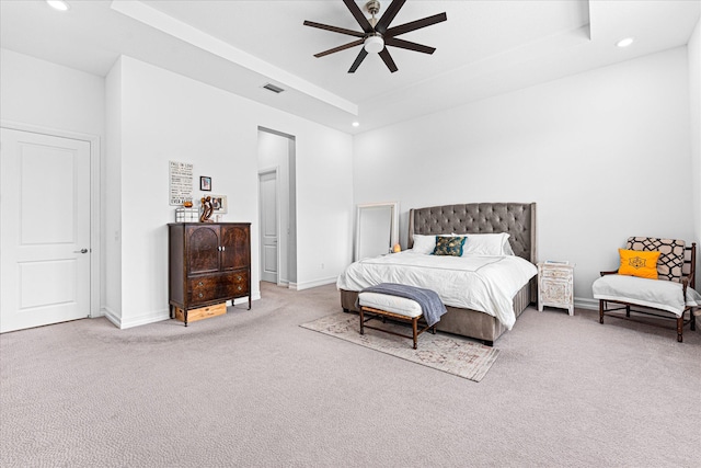 carpeted bedroom with baseboards, a raised ceiling, and recessed lighting