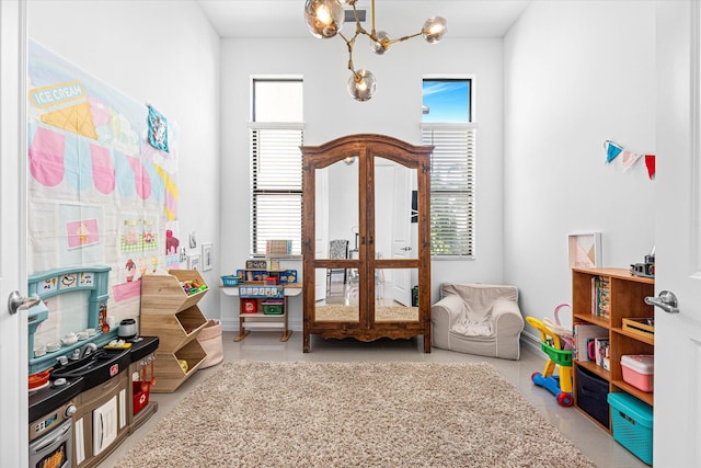 recreation room featuring a healthy amount of sunlight and visible vents