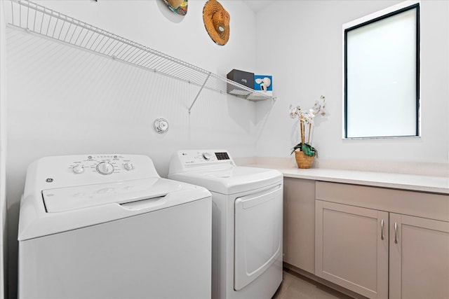 laundry room with cabinet space and washer and dryer