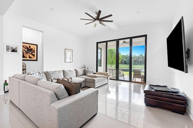 living area with vaulted ceiling with beams, light tile patterned floors, baseboards, and a ceiling fan