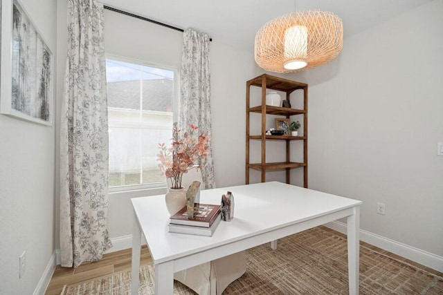 office featuring light wood-type flooring and baseboards