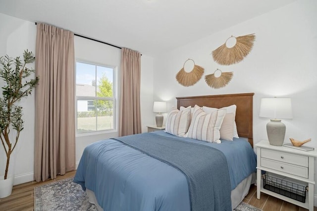 bedroom with wood finished floors