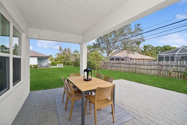 view of patio / terrace featuring outdoor dining space and fence