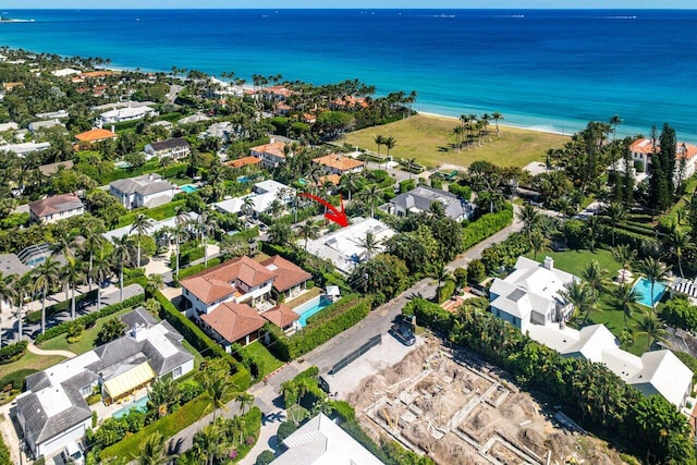 drone / aerial view with a water view and a residential view