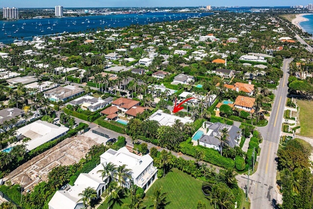 bird's eye view with a residential view and a water view