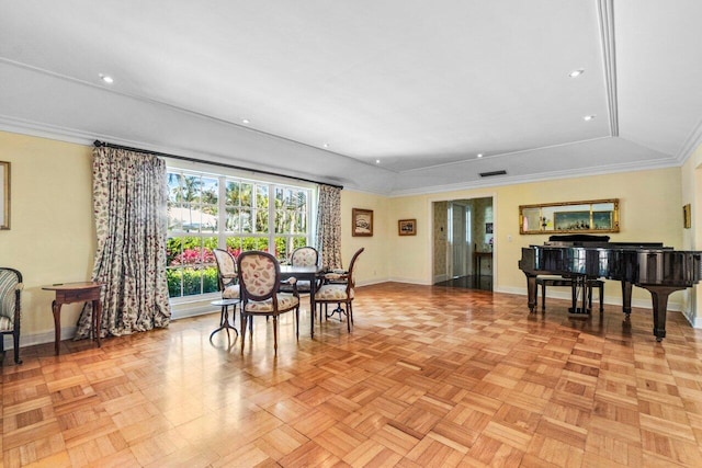 dining room with recessed lighting, a raised ceiling, crown molding, and baseboards